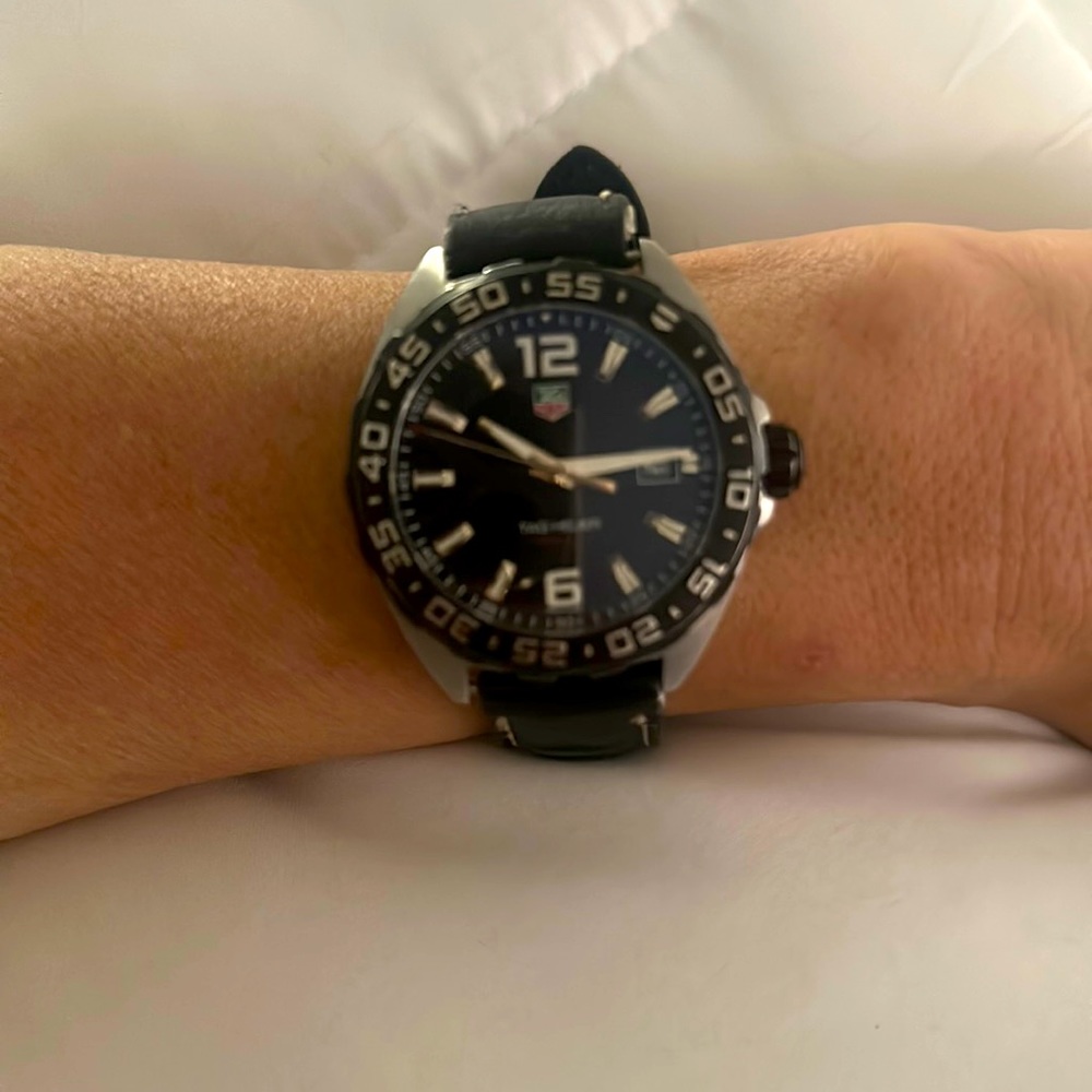 Tag worn leather Authentic band but needs replaced. Mint condition on watch.